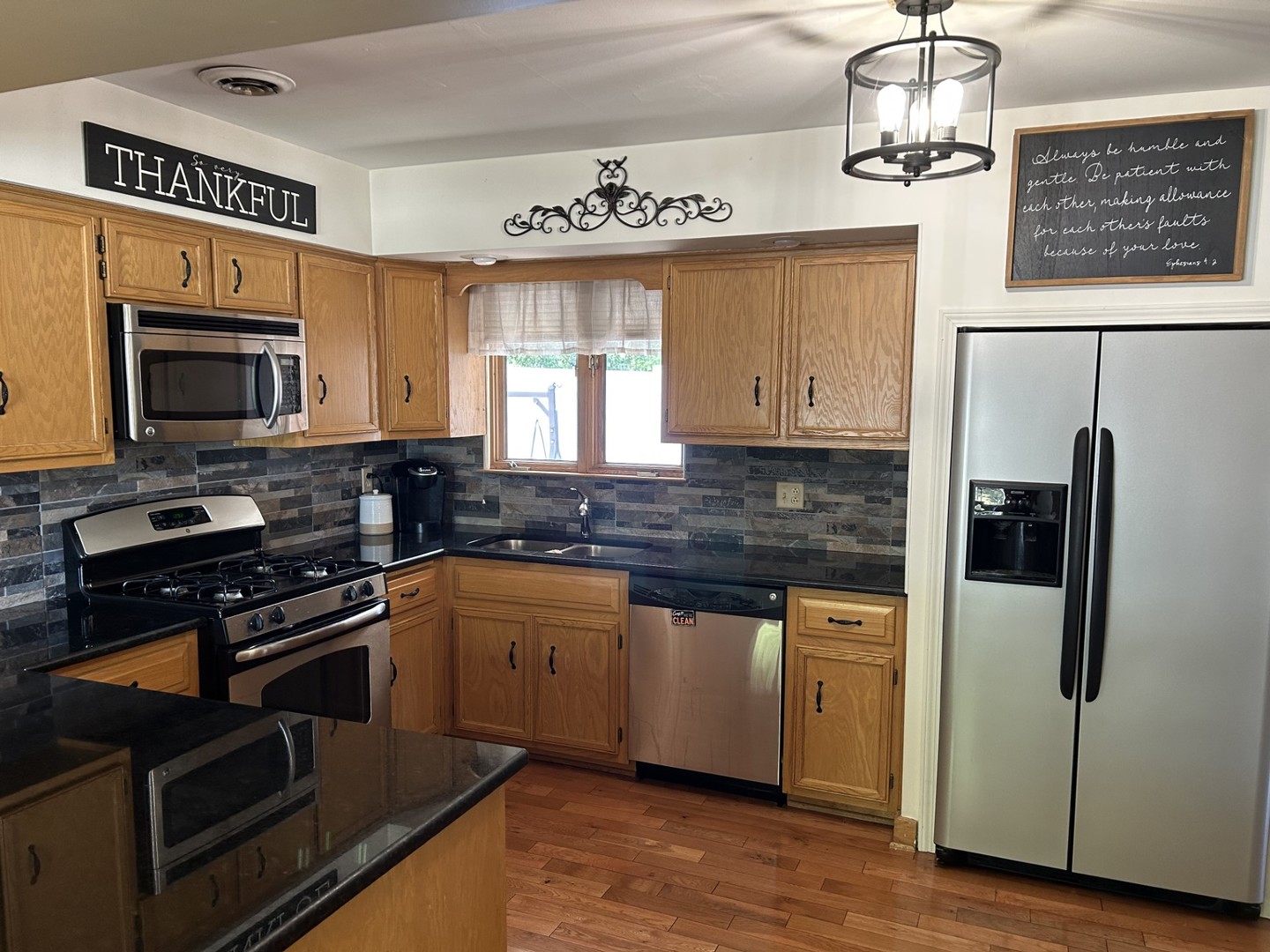 900 Read Street Lockport, IL 60441 - Photo 8 of 23 a kitchen with stainless steel appliances a stove a sink and a refrigerator