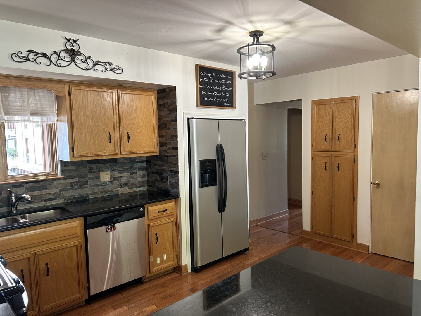 900 Read Street Lockport, IL 60441 - Photo 9 of 23 a kitchen with stainless steel appliances a refrigerator sink and cabinets
