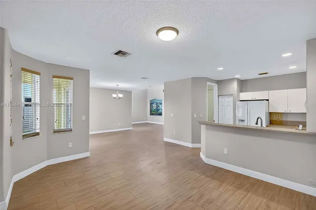 a view of a lake with houses in the back