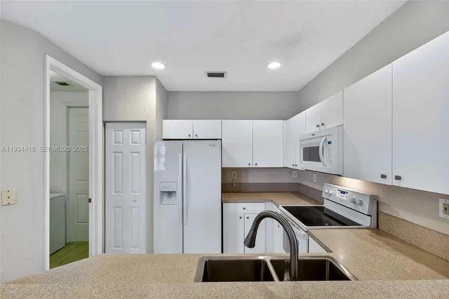 an aerial view of a house with a lake view