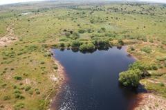 a view of a lake with a yard
