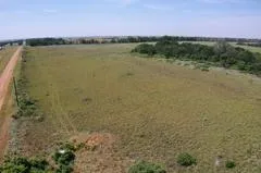 a view of a lake with beach and outdoor space