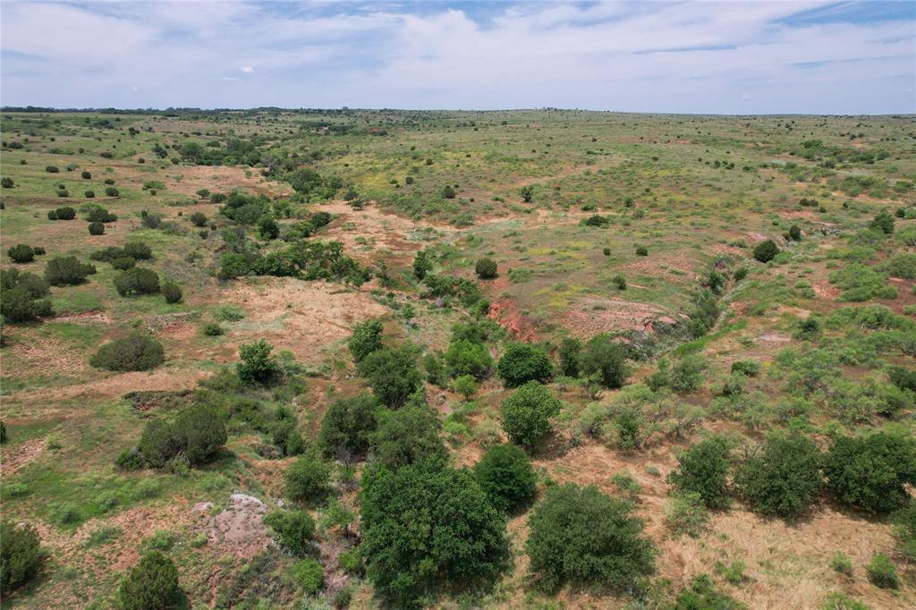 Tbd East 1420 Road Mangum, OK 73571 - Photo 25 of 40 a view of a yard with a building in the background