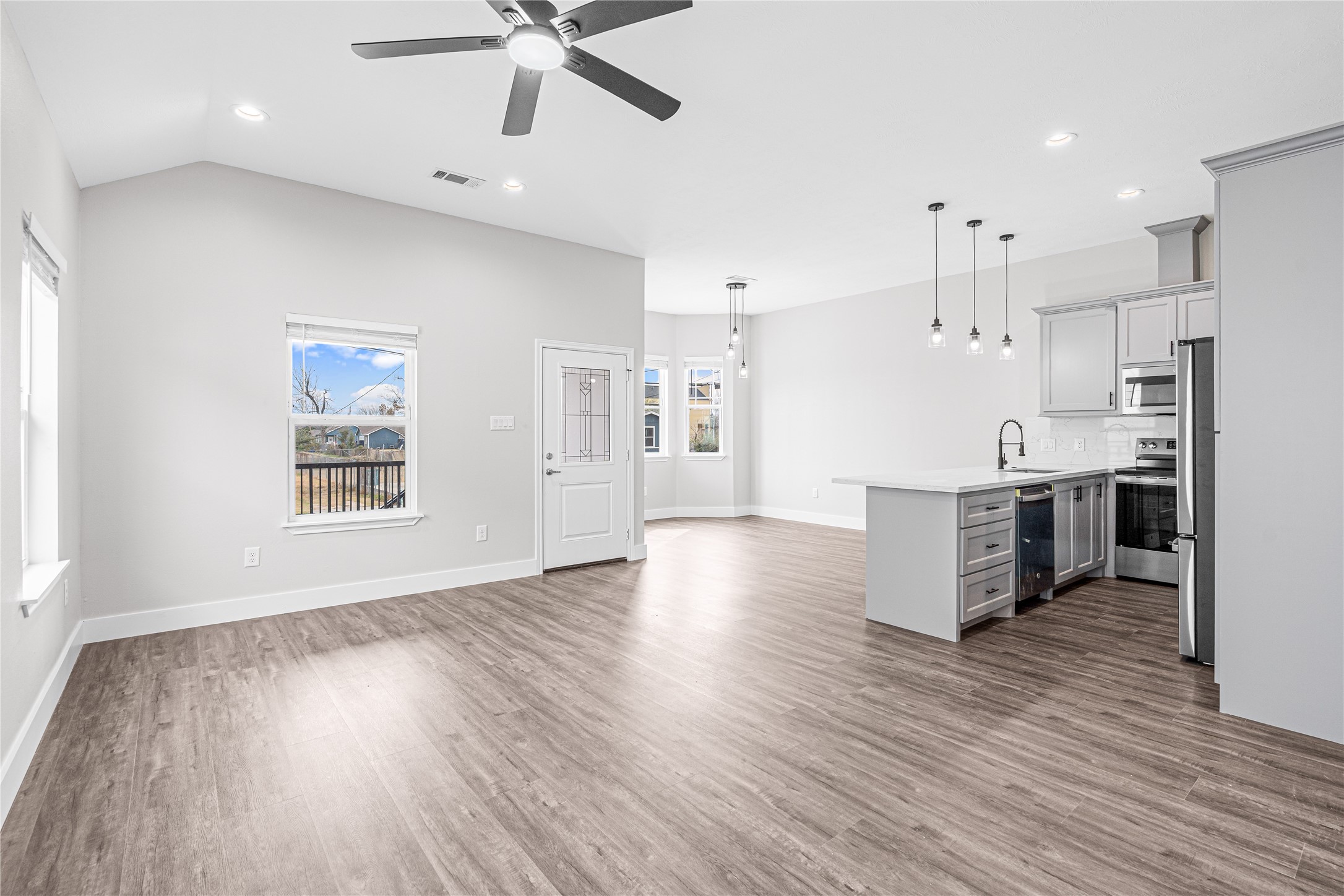 3821 Easy Street, Unit B Houston, TX 77026 - Photo 3 of 10 a view of kitchen with cabinets and wooden floor