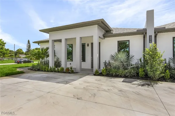 front view of a house with a yard