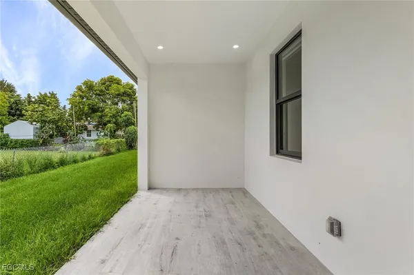 an aerial view of a house with garden space and street view