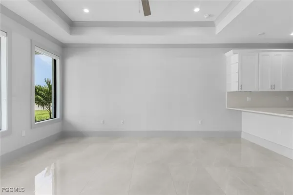a view of kitchen with microwave and cabinets