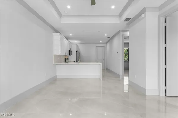 a kitchen with a sink and a refrigerator