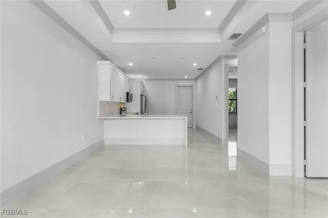 a kitchen with a sink and a refrigerator