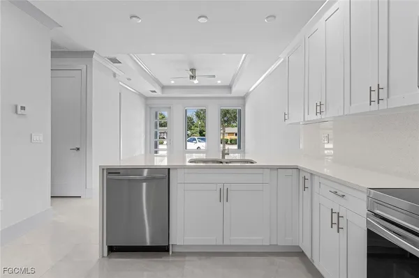 a bathroom with a sink a tub and a mirror