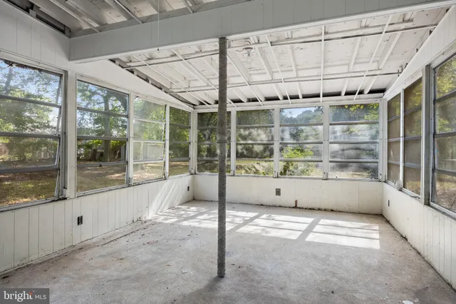 a view of an empty room with a balcony