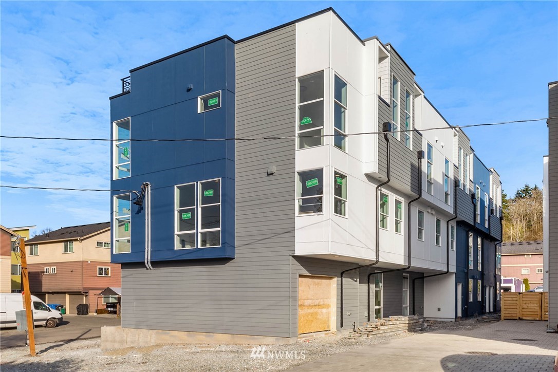 2403 Southwest Edmunds Street Seattle, WA 98106 - Photo 4 of 7 a front view of a building with street
