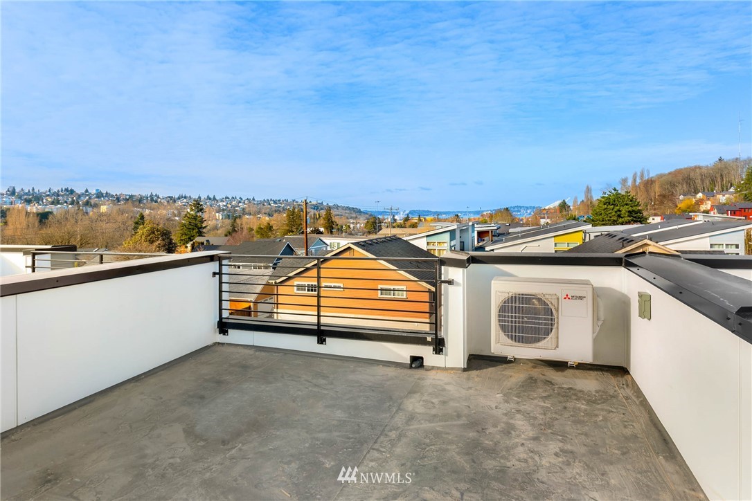 2403 Southwest Edmunds Street Seattle, WA 98106 - Photo 6 of 7 a view of a terrace with a bench