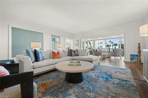 a living room with furniture and a table