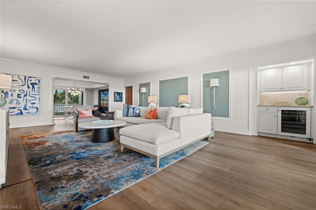 2901 Gulf Shore Boulevard North, Unit 101S Naples, FL 34103 - Photo 19 of 45 a living room with furniture and a fireplace