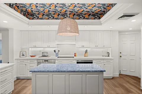 a kitchen with stainless steel appliances granite countertop a sink and cabinets