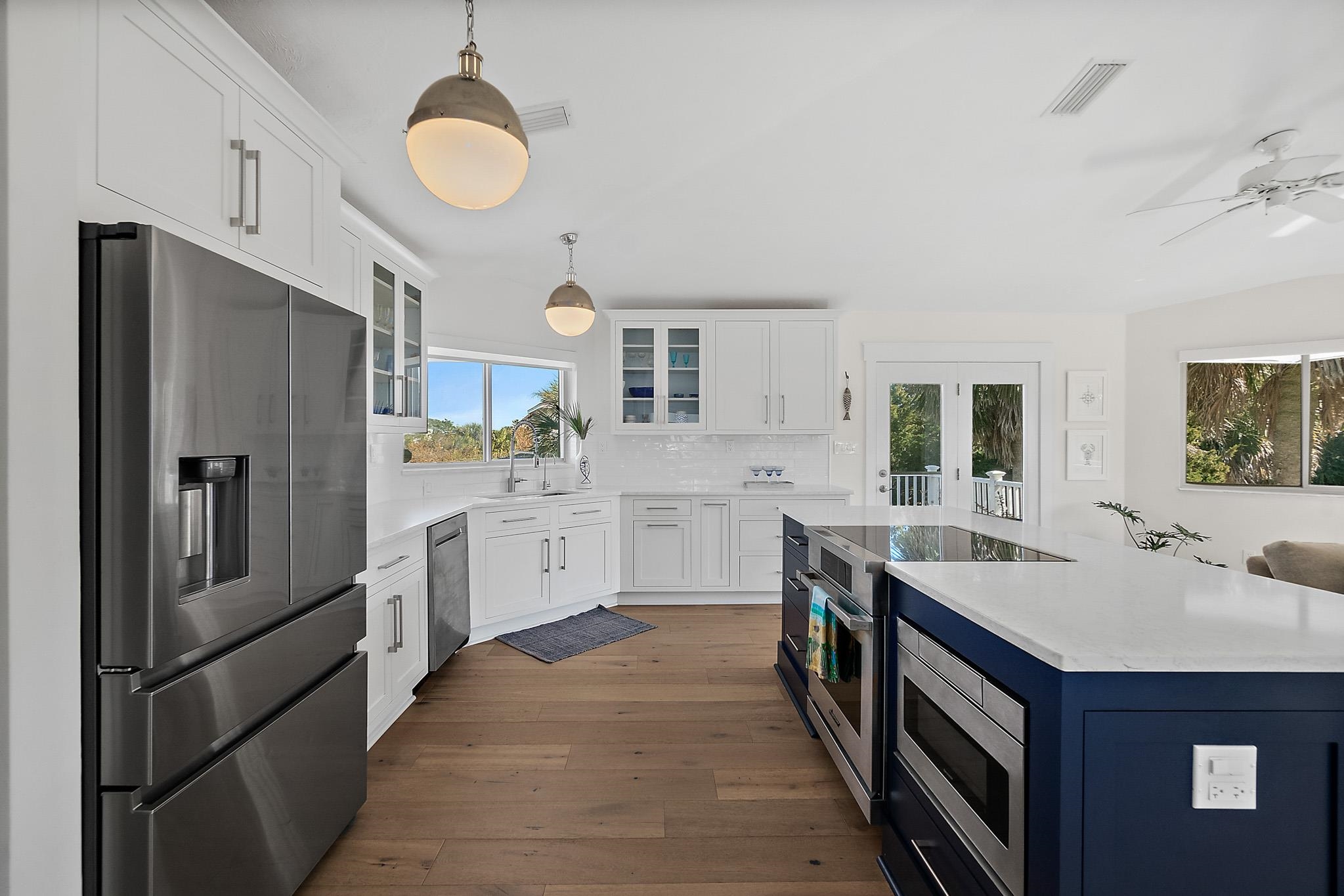 7 Sabor De Sal Road St. Augustine, FL 32080 - Photo 15 of 59 Microwave and cooktop in island