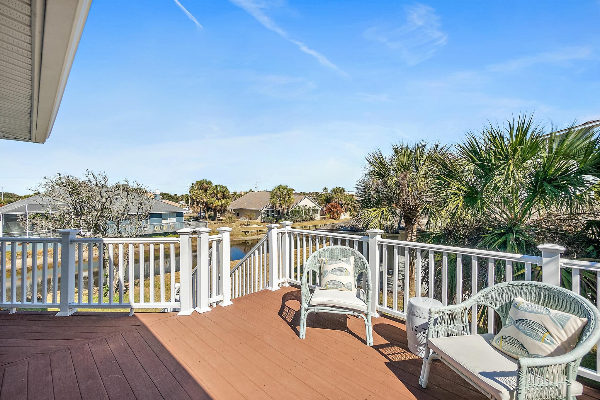 7 Sabor De Sal Road St. Augustine, FL 32080 - Photo 25 of 59 Wrap-around deck with access from living area or primary bedroom with a view to the pond
