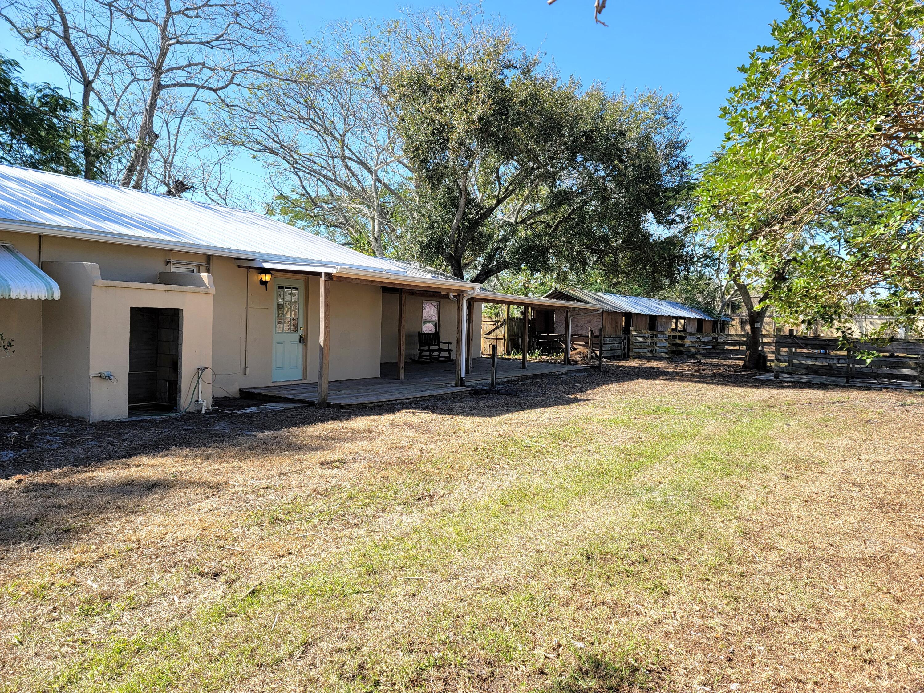 4362 West Midway Road Fort Pierce, FL 34981 - Photo 5 of 29 REAR OF HOME AND STABLES