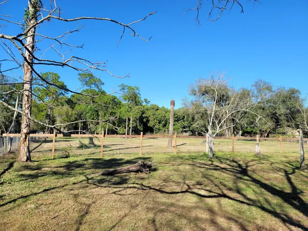 a view of a yard with swimming pool
