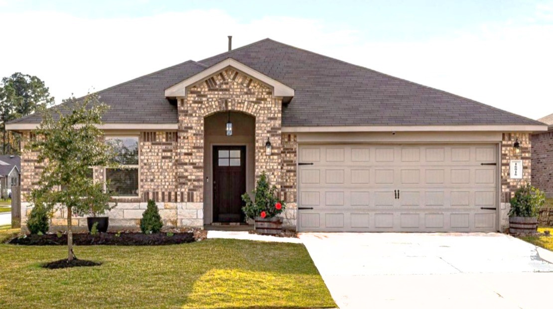 16016 Birch Bay Lane Conroe, TX 77384 - Photo 1 of 37 a front view of a house with a yard