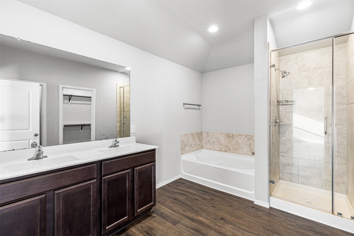 16016 Birch Bay Lane Conroe, TX 77384 - Photo 13 of 37 a bathroom with a tub sink and mirror