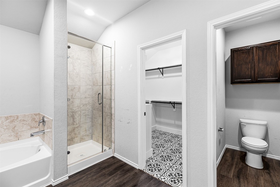 16016 Birch Bay Lane Conroe, TX 77384 - Photo 14 of 37 a bathroom with a shower and a toilet