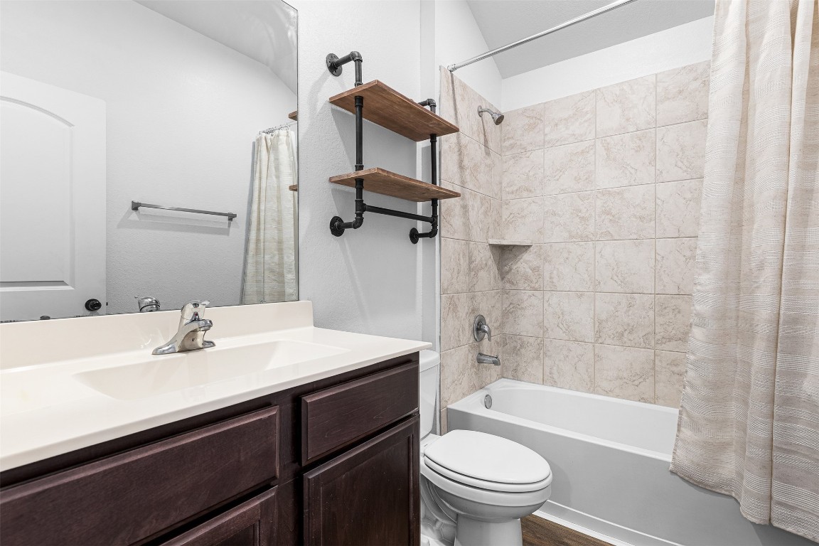 16016 Birch Bay Lane Conroe, TX 77384 - Photo 26 of 37 a bathroom with a sink a toilet and a bathtub