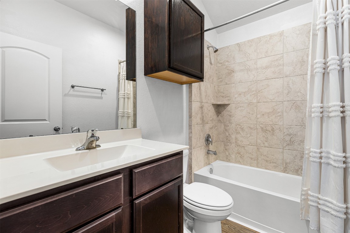 16016 Birch Bay Lane Conroe, TX 77384 - Photo 29 of 37 a bathroom with a sink a toilet and shower