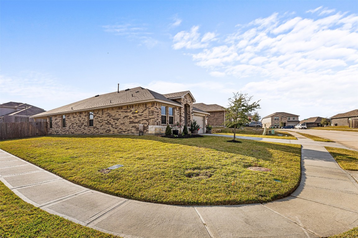 16016 Birch Bay Lane Conroe, TX 77384 - Photo 3 of 37 a view of a swimming pool with a lawn chairs