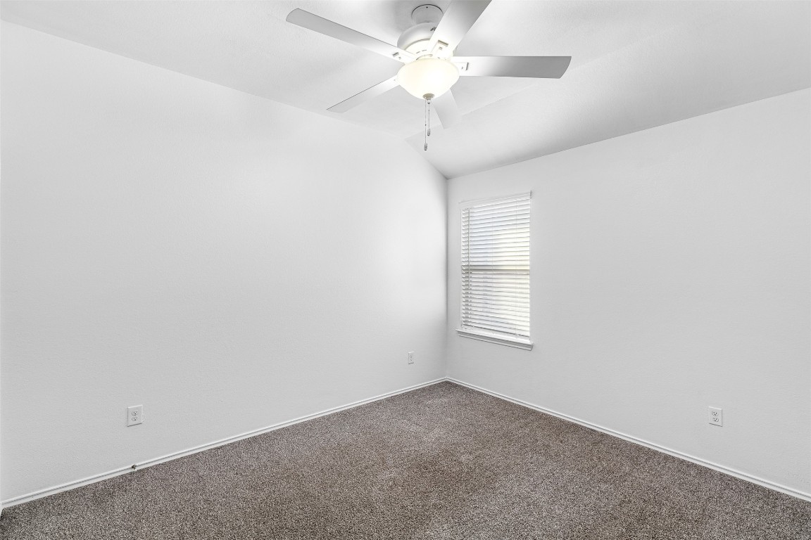 16016 Birch Bay Lane Conroe, TX 77384 - Photo 31 of 37 an empty room with a window and a fan