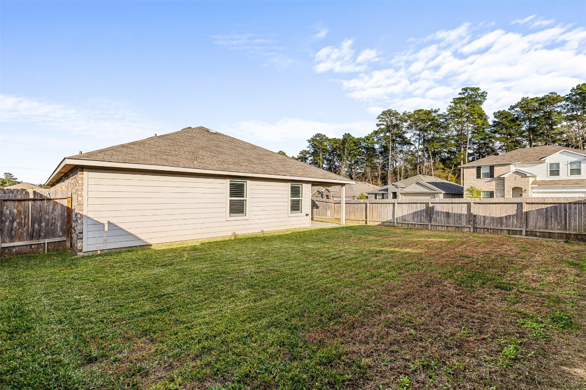 16016 Birch Bay Lane Conroe, TX 77384 - Photo 35 of 37 a house view with a garden space