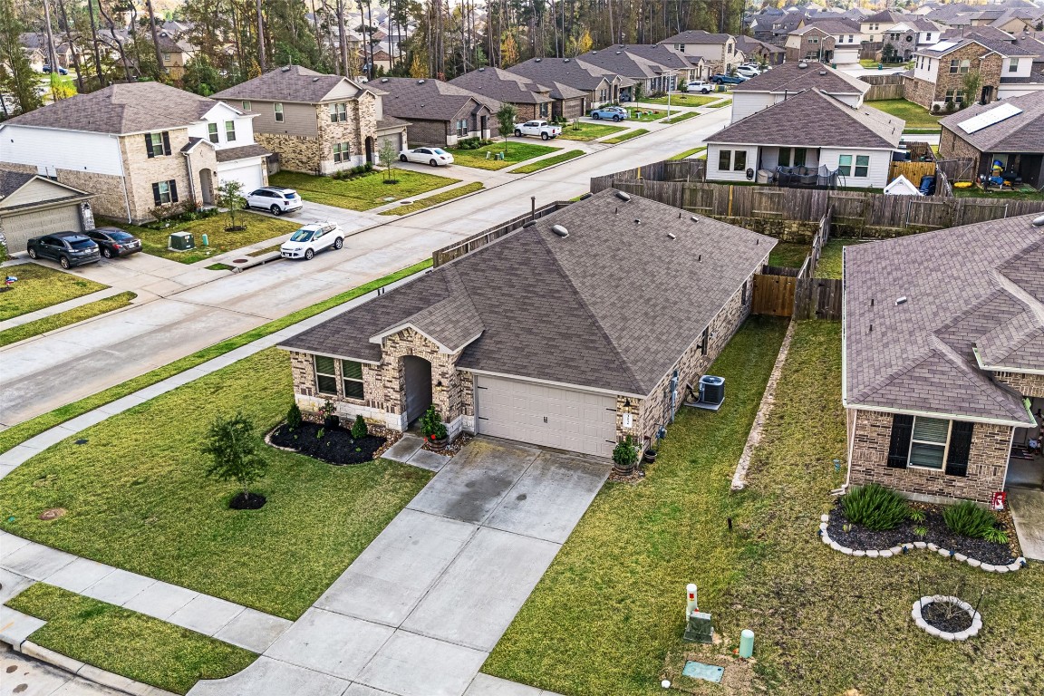 16016 Birch Bay Lane Conroe, TX 77384 - Photo 37 of 37 a aerial view of a house with swimming pool