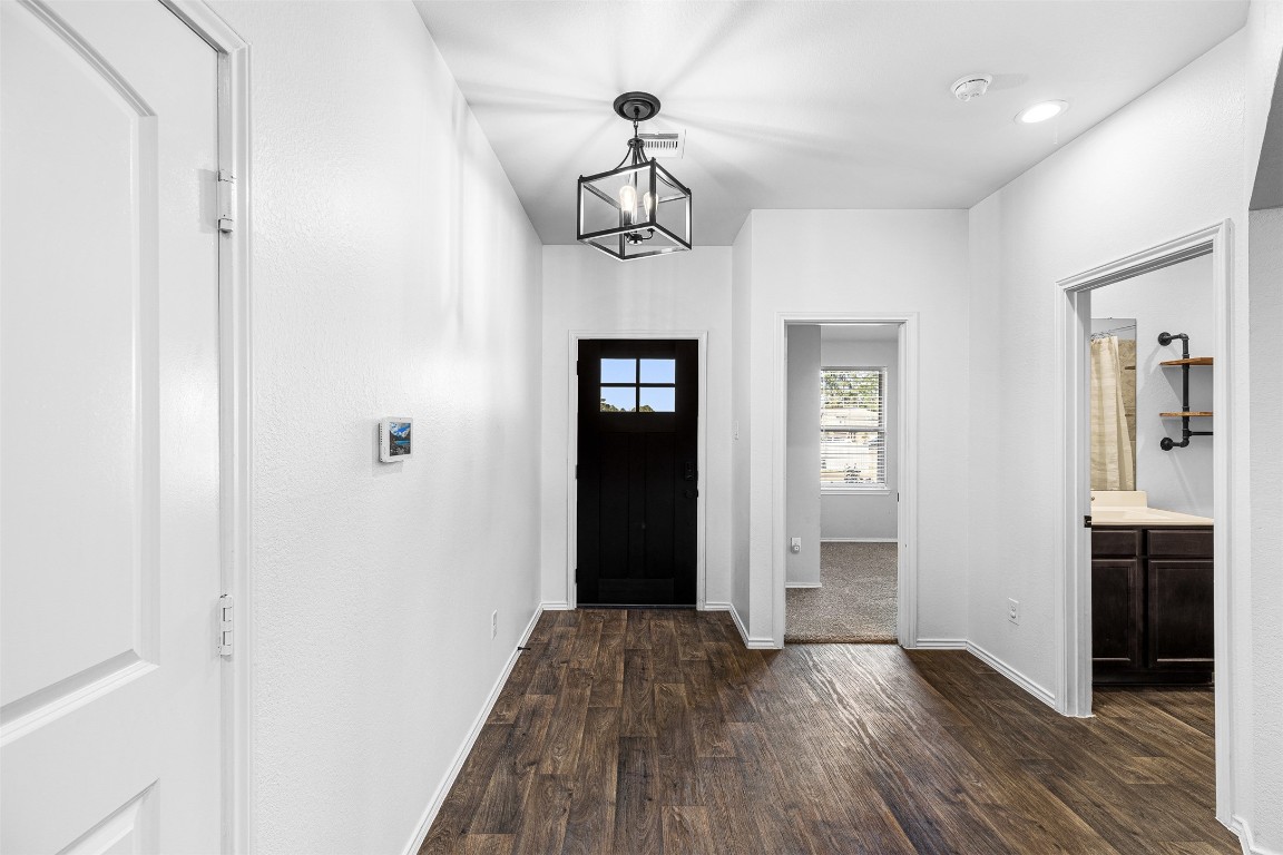 16016 Birch Bay Lane Conroe, TX 77384 - Photo 4 of 37 a view of a hallway with wooden floor and staircase