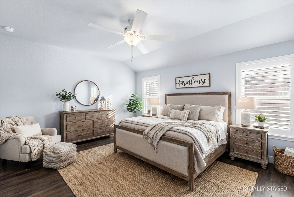 16016 Birch Bay Lane Conroe, TX 77384 - Photo 9 of 37 a bedroom with a bed and a chandelier
