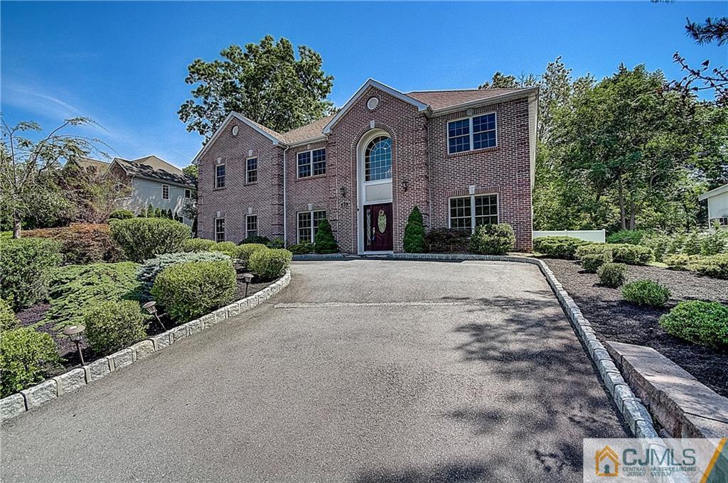 35 Williams Road Edison, NJ 08820 - Photo 2 of 47 a front view of a house with a yard and garage
