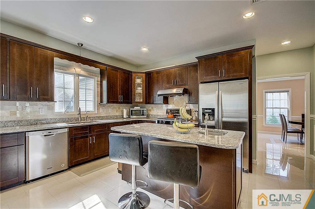 35 Williams Road Edison, NJ 08820 - Photo 11 of 47 a kitchen with a sink stainless steel appliances cabinets and furniture