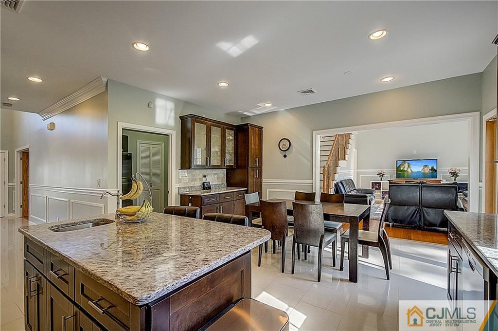 35 Williams Road Edison, NJ 08820 - Photo 14 of 47 a kitchen with center island table and chairs