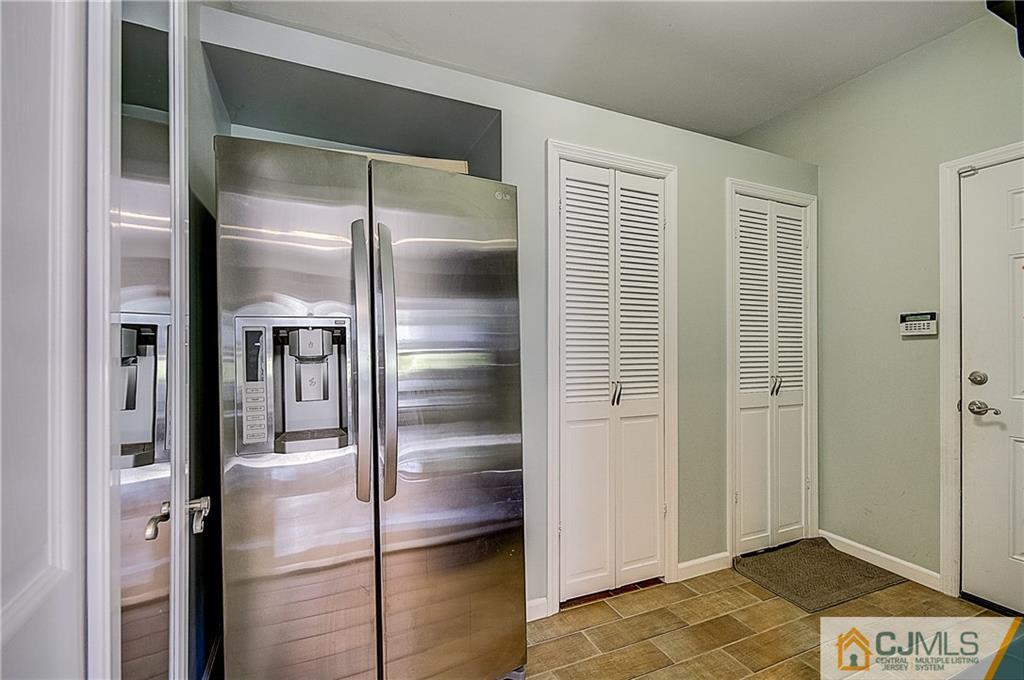 35 Williams Road Edison, NJ 08820 - Photo 18 of 47 a view of a refrigerator in kitchen and an empty room