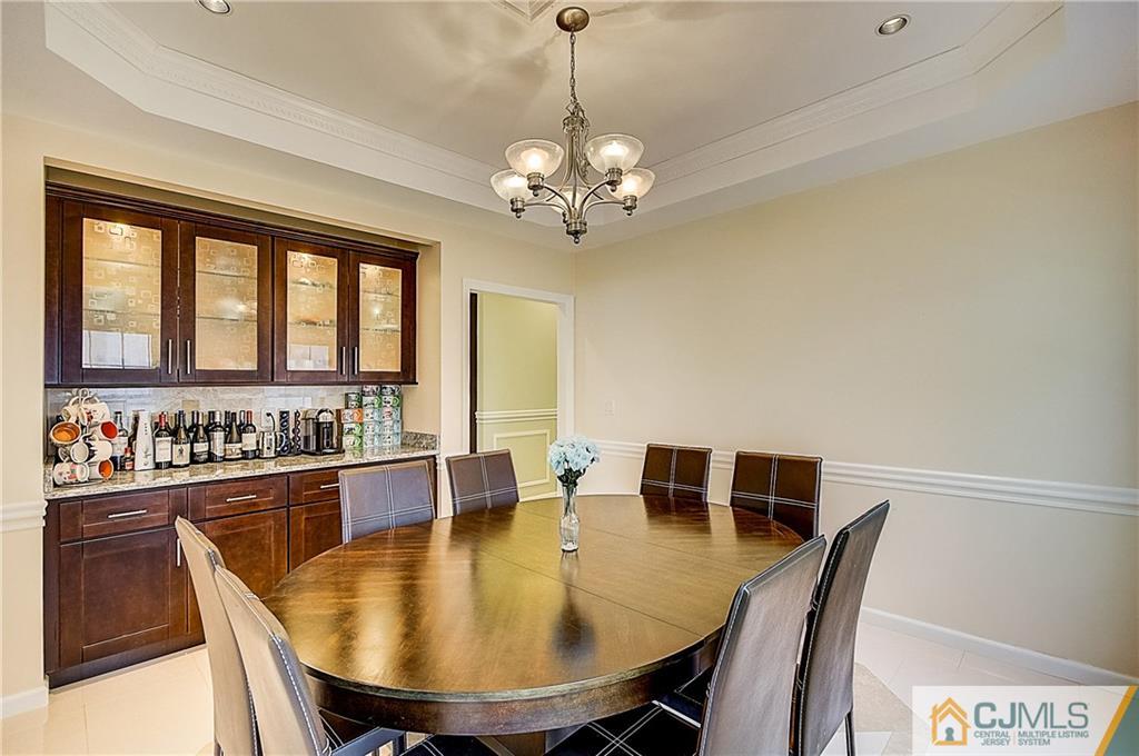 35 Williams Road Edison, NJ 08820 - Photo 19 of 47 a dining room with stainless steel appliances a dining table and chairs