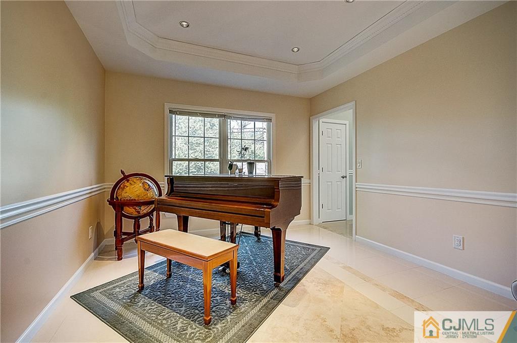 35 Williams Road Edison, NJ 08820 - Photo 22 of 47 a living room with furniture a rug and a window