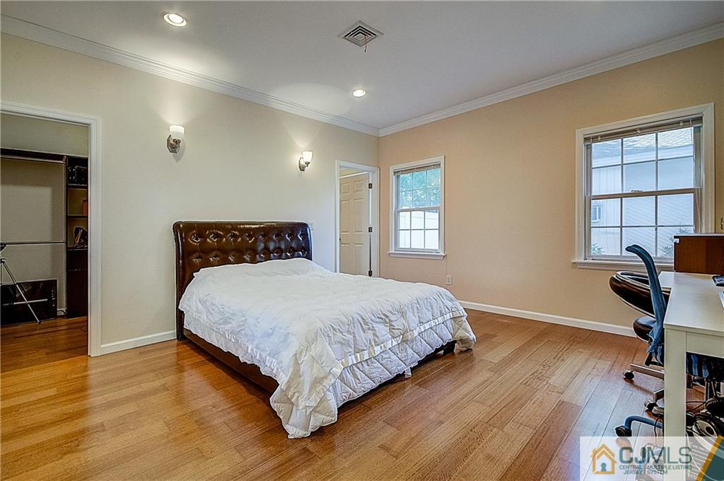 35 Williams Road Edison, NJ 08820 - Photo 24 of 47 a bedroom with a bed and wooden floor