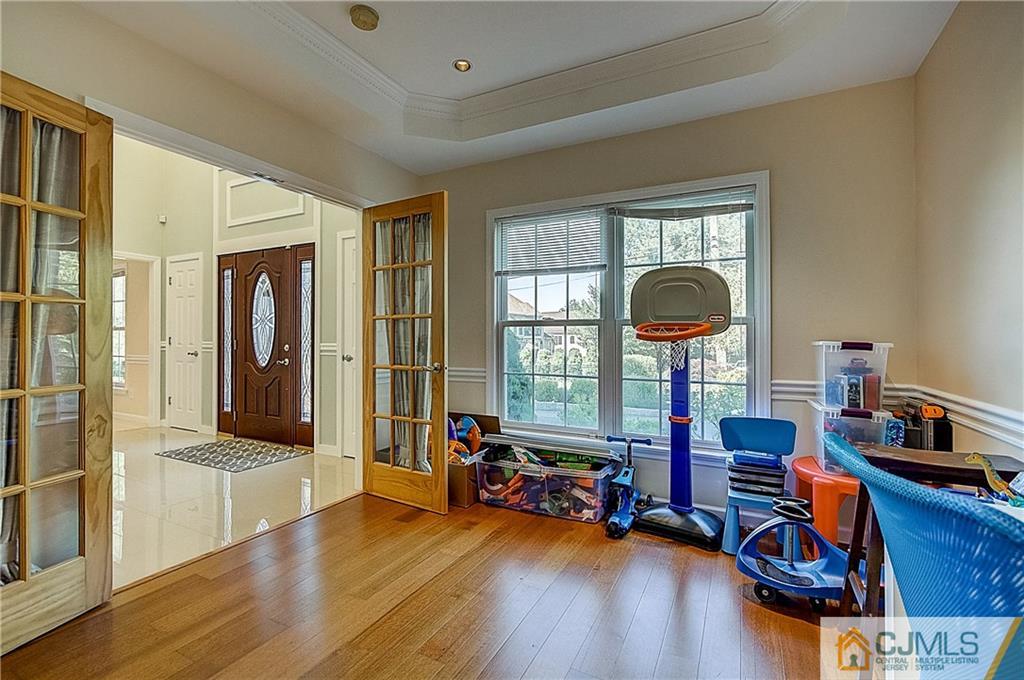 35 Williams Road Edison, NJ 08820 - Photo 28 of 47 a view of a livingroom with furniture a fireplace and wooden floor