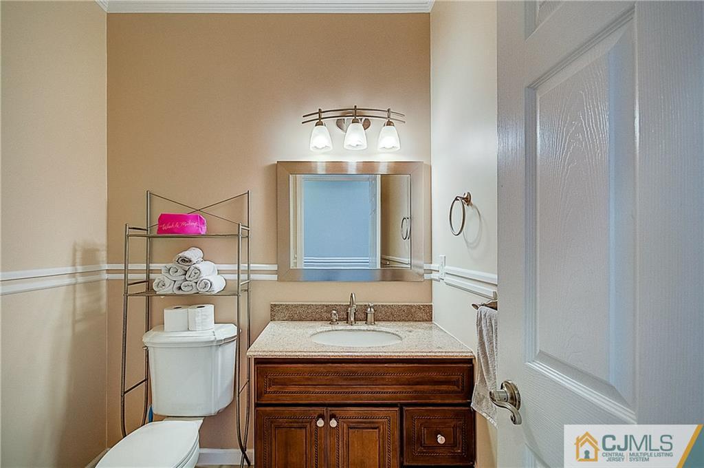 35 Williams Road Edison, NJ 08820 - Photo 29 of 47 a bathroom with a sink vanity mirror and toilet