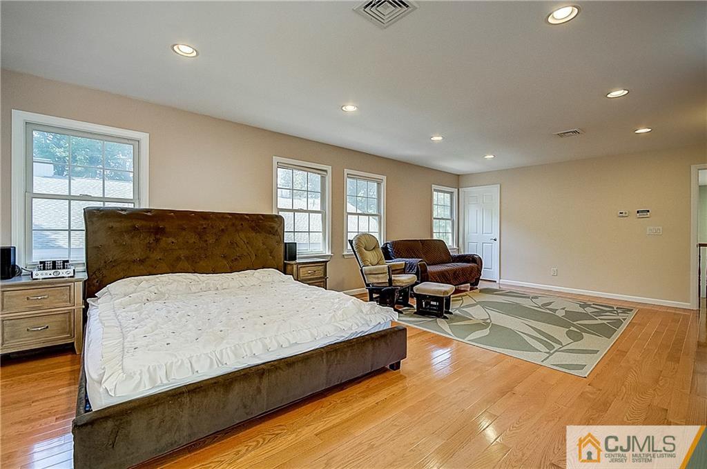 35 Williams Road Edison, NJ 08820 - Photo 31 of 47 a spacious bedroom with a bed and furniture