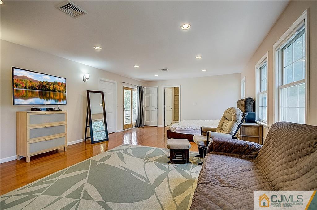 35 Williams Road Edison, NJ 08820 - Photo 32 of 47 a living room with furniture and a flat screen tv