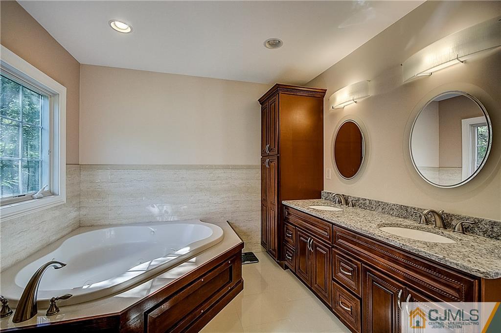 35 Williams Road Edison, NJ 08820 - Photo 34 of 47 a bathroom with a granite countertop double vanity and a mirror