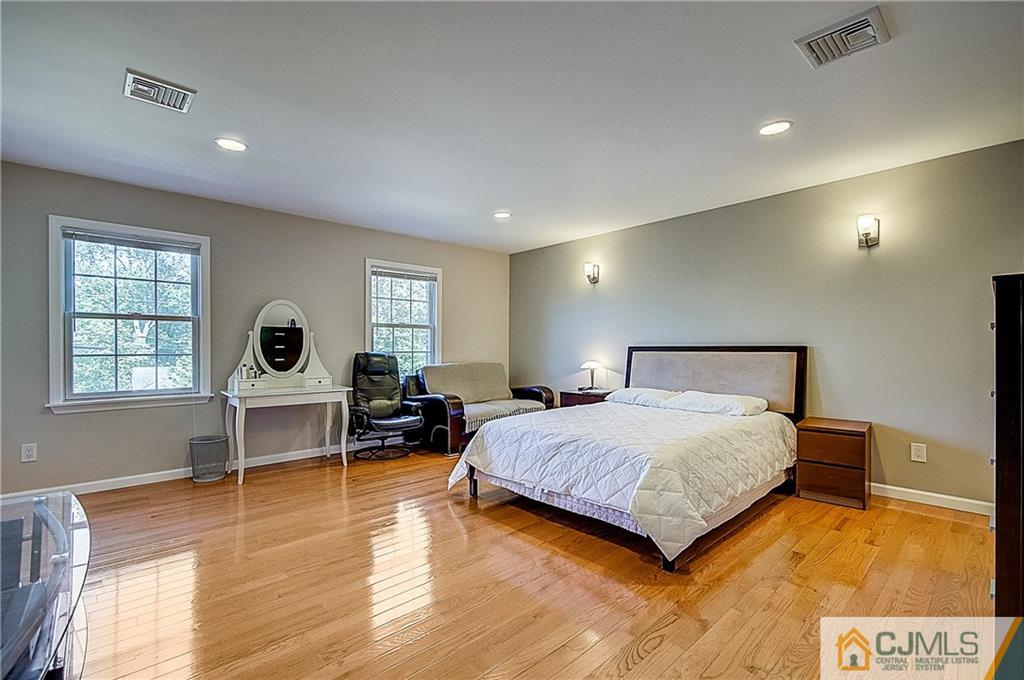 35 Williams Road Edison, NJ 08820 - Photo 35 of 47 a bedroom with a bed and wooden floor