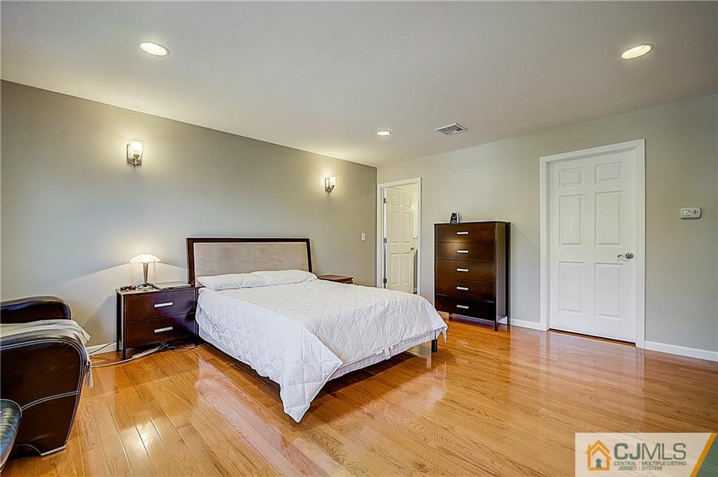 35 Williams Road Edison, NJ 08820 - Photo 36 of 47 a bedroom with a bed and wooden floor