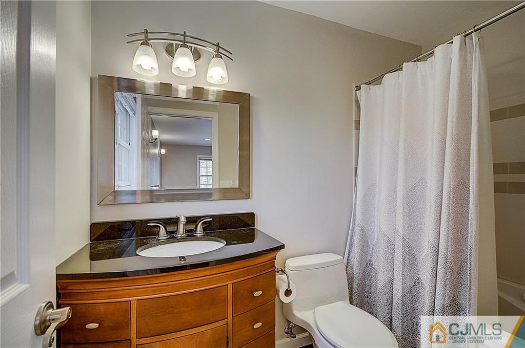 35 Williams Road Edison, NJ 08820 - Photo 38 of 47 a bathroom with a sink a toilet and a mirror